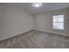 Neutral bedroom features carpeted floor, a window with blinds, and a flush ceiling light at 1415 Southern Ave, Lakeland, FL 33803