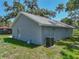 The home's exterior has an AC unit and a well-maintained lawn at 1415 Southern Ave, Lakeland, FL 33803