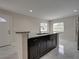 Kitchen island with granite countertop and dark wood cabinets at 1415 Southern Ave, Lakeland, FL 33803