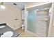 Bathroom with a double sink vanity, ceramic tile flooring, and walk in shower at 1628 Lakewood S Dr, Lakeland, FL 33813