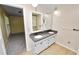 Bathroom featuring a double vanity with modern fixtures and a bright, airy feel at 1628 Lakewood S Dr, Lakeland, FL 33813