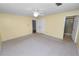 Neutral-toned bedroom with plush carpeting, dual closets and en suite bathroom at 1628 Lakewood S Dr, Lakeland, FL 33813