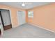 Bedroom with a ceiling fan, neutral walls and carpet, and a closet at 1628 Lakewood S Dr, Lakeland, FL 33813