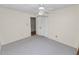 Bedroom with a ceiling fan, neutral walls and carpet, and a closet at 1628 Lakewood S Dr, Lakeland, FL 33813