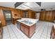 Open concept kitchen with center island, stainless steel dishwasher, and lots of cabinets at 1628 Lakewood S Dr, Lakeland, FL 33813