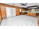 Spacious kitchen with wood cabinets, island and a large tile floor at 1628 Lakewood S Dr, Lakeland, FL 33813