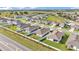 Bird's eye view of neighborhood homes with fenced yards and manicured landscaping at 1725 Hill Top Dr, Dundee, FL 33838
