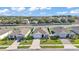 View of homes on tree-lined streets in a well-planned residential community at 1725 Hill Top Dr, Dundee, FL 33838