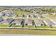 An aerial view shows the backyards of several homes in a residential neighborhood at 1725 Hill Top Dr, Dundee, FL 33838