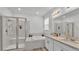 Serene bathroom with a walk-in shower, soaking tub, double vanity, and elegant subway tile accents at 1725 Hill Top Dr, Dundee, FL 33838