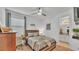 Cozy bedroom offers a ceiling fan, natural light and access to an attached bathroom at 1725 Hill Top Dr, Dundee, FL 33838