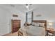 Comfortable bedroom features a ceiling fan, natural light and neutral decor at 1725 Hill Top Dr, Dundee, FL 33838