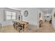 Open concept dining area offers tan tile floors and seating for six at 1725 Hill Top Dr, Dundee, FL 33838