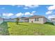 Well-maintained home with a green lawn and neutral exterior in a quiet neighborhood at 1725 Hill Top Dr, Dundee, FL 33838