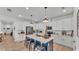 Bright kitchen featuring a center island with seating, modern appliances, and ample white cabinetry at 1725 Hill Top Dr, Dundee, FL 33838