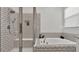 Modern bathroom featuring a glass shower, soaking tub, and tiled shower at 1725 Hill Top Dr, Dundee, FL 33838