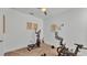 Workout room features an elliptical, stationary bike and ample natural light at 1725 Hill Top Dr, Dundee, FL 33838