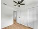 Bright bedroom with hardwood floors and a closet offering functional space at 1728 Bush Ave, Lakeland, FL 33805