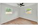 Bright bedroom featuring hardwood floors and two windows providing lots of natural light at 1728 Bush Ave, Lakeland, FL 33805