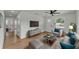 Bright living room with modern furnishings, light-colored walls, wood flooring and large windows at 1728 Bush Ave, Lakeland, FL 33805