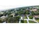 A neighborhood showcases residences nestled amongst mature trees and green landscaping at 1920 Indian Trails Ct, Lakeland, FL 33813
