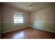 Bedroom with neutral wallpaper and a large window at 1920 Indian Trails Ct, Lakeland, FL 33813