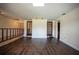 Spacious living room showcasing dark wood floors, French doors, and natural light at 1920 Indian Trails Ct, Lakeland, FL 33813
