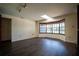 Open living room features a skylight, bay window, and hardwood floors at 1920 Indian Trails Ct, Lakeland, FL 33813