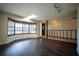 Bright living room featuring a skylight, large bay window, and dark wood flooring at 1920 Indian Trails Ct, Lakeland, FL 33813