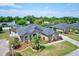 Birds-eye view of a single story house with a well manicured lawn and neutral exterior paint at 2032 Indian Sky Cir, Lakeland, FL 33813