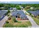 An aerial view of a lovely single-story home featuring a driveway and lush lawn at 2032 Indian Sky Cir, Lakeland, FL 33813