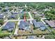 Aerial view of home featuring fenced backyard with pool and lush landscaping in a quiet neighborhood at 2032 Indian Sky Cir, Lakeland, FL 33813