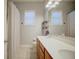 Bright bathroom featuring a double sink vanity, large mirror, and natural light from the window at 2032 Indian Sky Cir, Lakeland, FL 33813