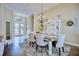 Dining room featuring a stylish chandelier, elegant furnishings, and an open view of the home's entryway at 2032 Indian Sky Cir, Lakeland, FL 33813