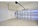 Well-lit garage featuring a door and a rolling garage door at 2032 Indian Sky Cir, Lakeland, FL 33813