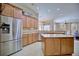 Bright kitchen with stainless steel appliances, an island, plenty of cabinet space, and an open layout at 2032 Indian Sky Cir, Lakeland, FL 33813