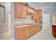 This kitchen features wooden cabinets, tile floors, and modern appliances at 2032 Indian Sky Cir, Lakeland, FL 33813