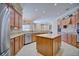 Spacious kitchen featuring an island, stainless steel appliances, and ample cabinet space at 2032 Indian Sky Cir, Lakeland, FL 33813