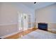 Bright living room with hardwood flooring, a chair and french doors for lots of light at 2032 Indian Sky Cir, Lakeland, FL 33813