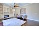 Bright living room with hardwood floors, built-in shelves, and large area rug at 2032 Indian Sky Cir, Lakeland, FL 33813