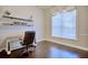 Bright home office features built-in shelves, hardwood floors, and a large window at 2032 Indian Sky Cir, Lakeland, FL 33813