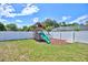 Backyard playground featuring a slide, swings, and climbing area at 2032 Indian Sky Cir, Lakeland, FL 33813