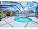 Inviting screened-in pool with lounge chairs and backyard views at 2032 Indian Sky Cir, Lakeland, FL 33813