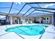 Beautiful screened-in pool with clear water and lounge chairs at 2032 Indian Sky Cir, Lakeland, FL 33813