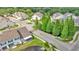 Aerial view of the neighborhood's well-maintained streets and common areas with mature trees at 2047 Winterset Dr, Lakeland, FL 33813