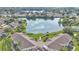 Scenic aerial view showcases lakeside community, complete with gazebo and tranquil pond views at 2047 Winterset Dr, Lakeland, FL 33813