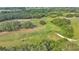 Scenic aerial view of lush golf course with trees and cart paths for outdoor recreation at 2047 Winterset Dr, Lakeland, FL 33813