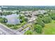 Beautiful aerial view showcasing the community's serene lake and surrounding lush greenery at 2047 Winterset Dr, Lakeland, FL 33813