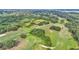 Lush golf course aerial view with green fairways, trees, and open spaces for recreational enjoyment at 2047 Winterset Dr, Lakeland, FL 33813