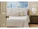 Bedroom with a large window, complemented by elegant lamps on the bedside tables at 2047 Winterset Dr, Lakeland, FL 33813